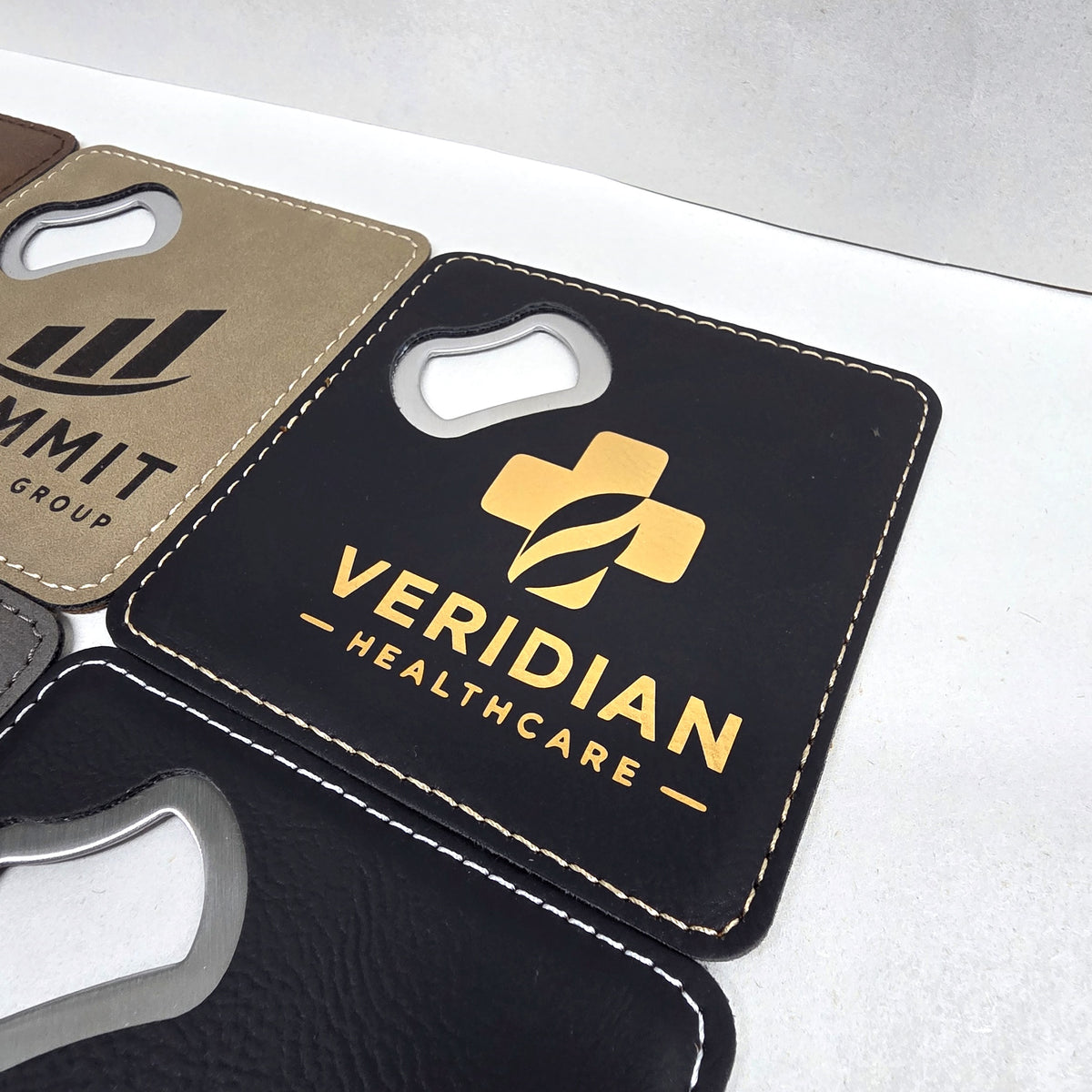 Black and gold leatherette coaster bottle opener with gold engraving