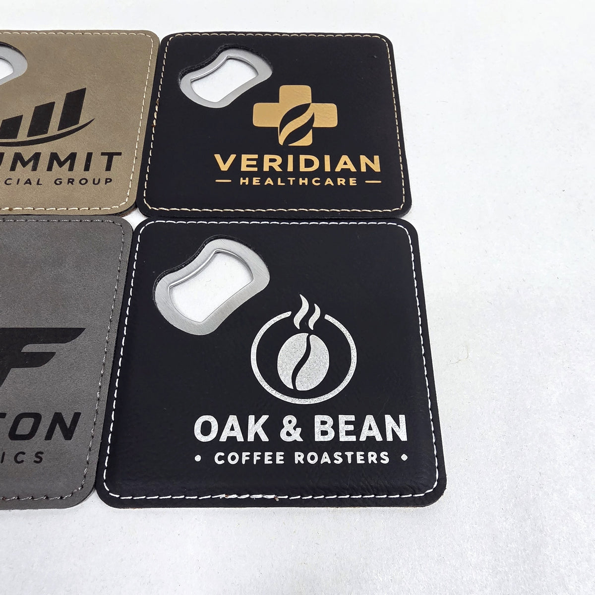 Black and gold leatherette coaster bottle opener pair with engraved logos