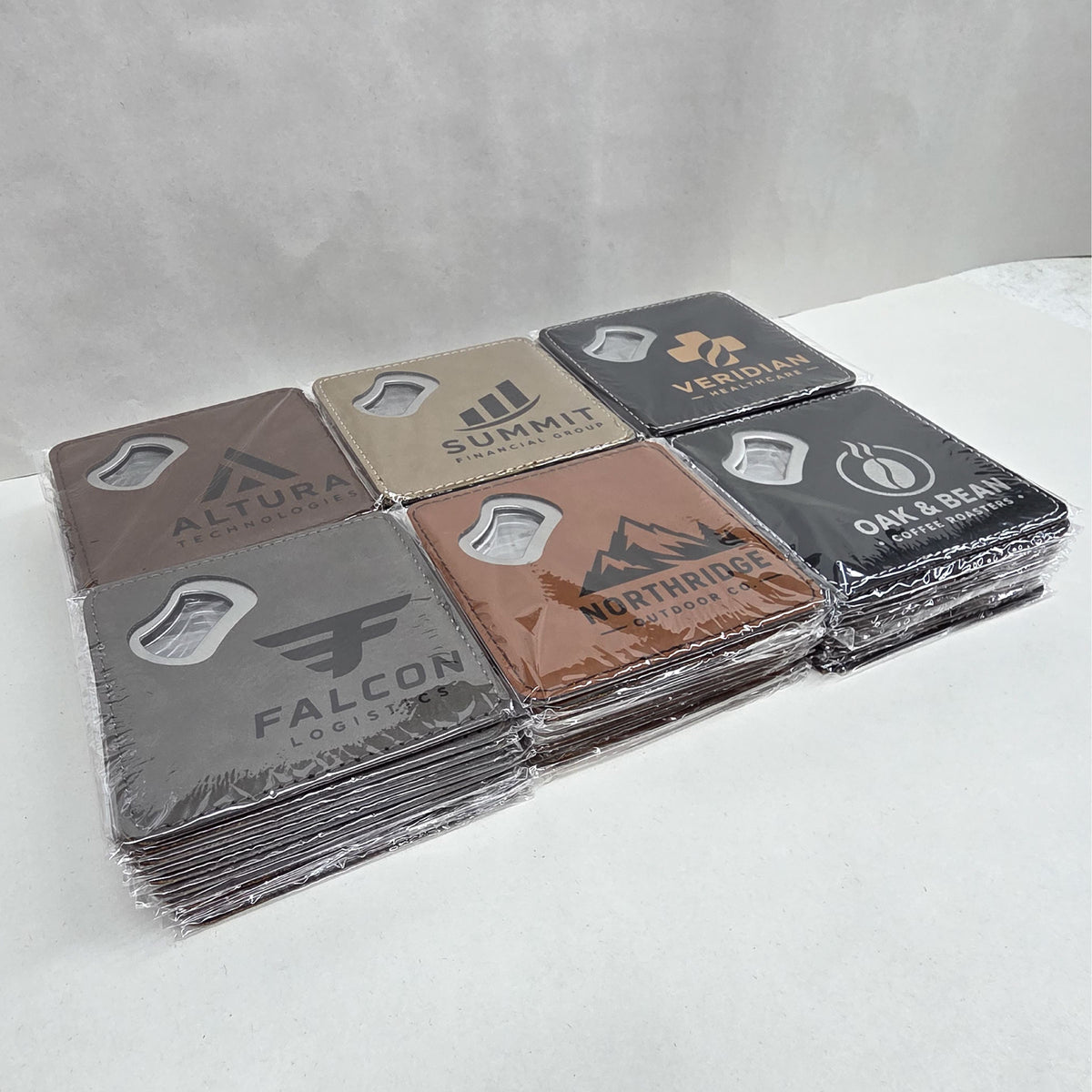 Stack of leatherette coaster bottle openers prepared for a bulk order